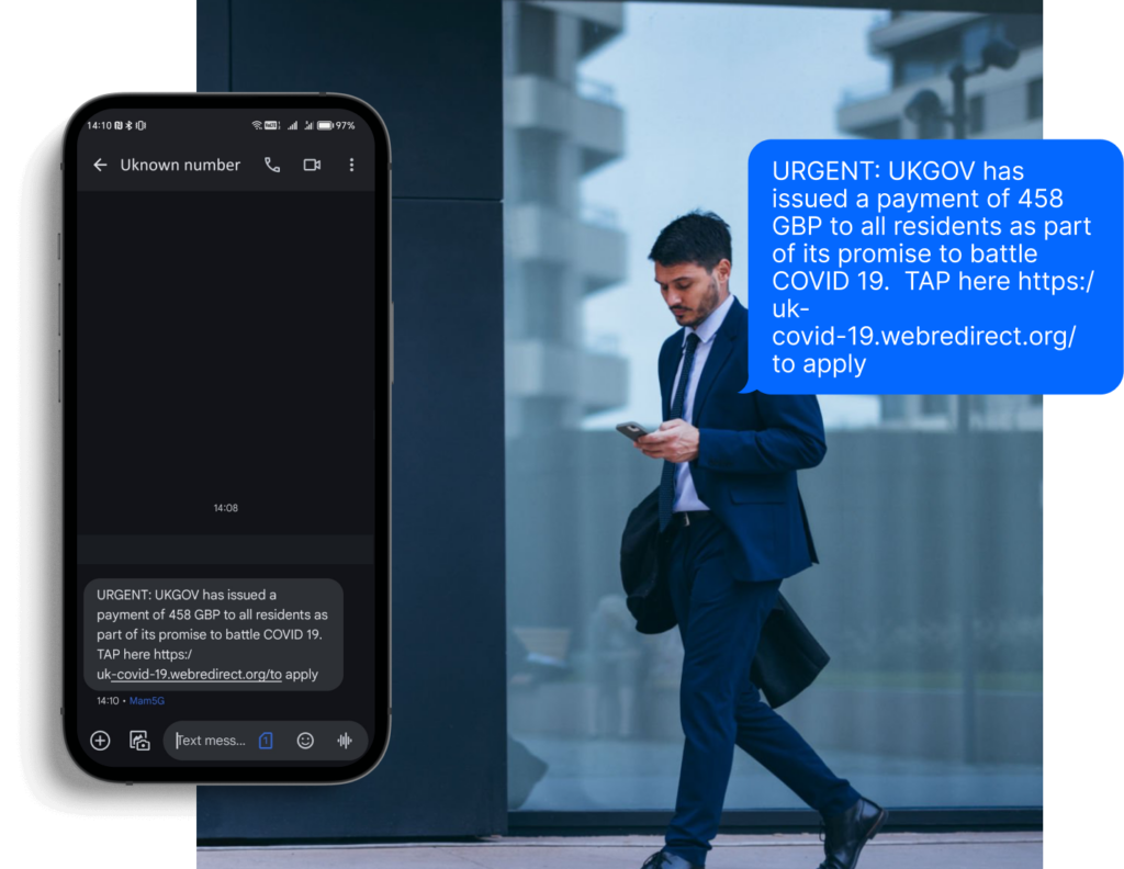 A man in a suit reading a suspicious message on his mobile phone from an unknown number